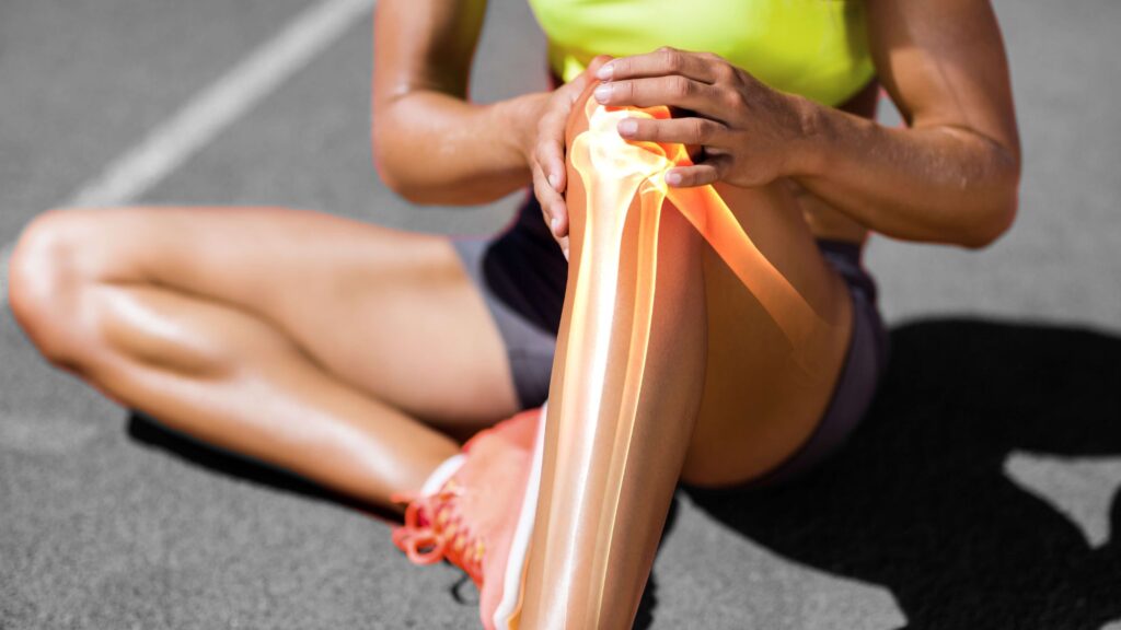 How Can Physiotherapy Helps To Manage Your Pain & Injury? 2 A girl holding her knee due to pain & injury