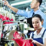 Employees implementing effective strategies to enhance textile industry production